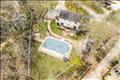 Backyard is a private oasis with in-ground pool.