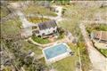 Backyard is a private oasis with in-ground pool.