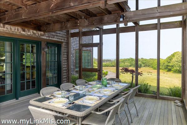 Large screened-in porch with waterviews