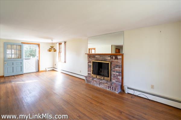 Living Room with Hardwood Floors & Fireplace
