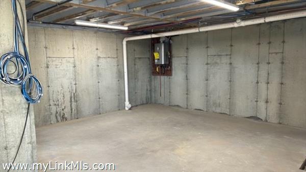 Storage in Basement  with on demand hot water tank and electrical panel