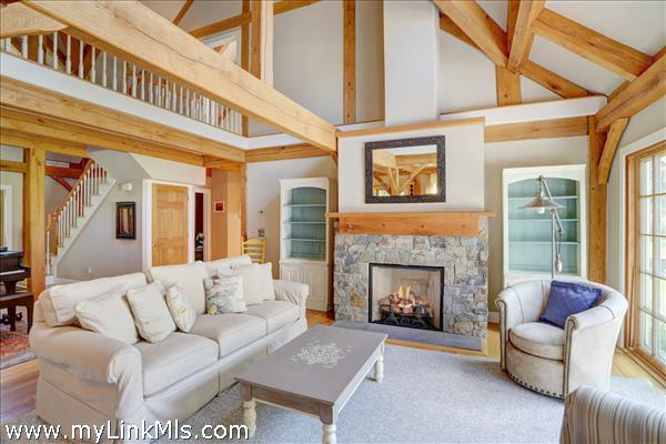 Living Room with fireplace and french doors to back deck