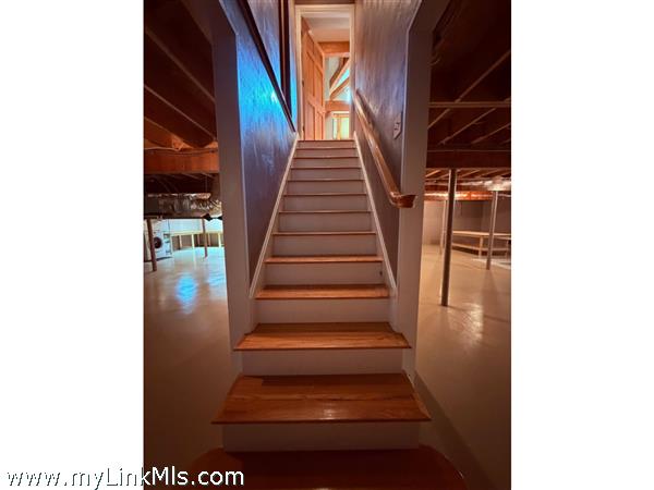 Stairs to the first floor from basement