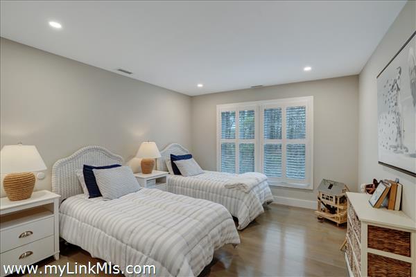 Second floor guest bedroom with en suite bath.