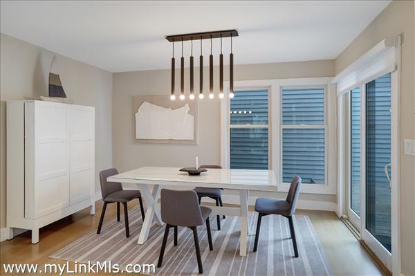 Dining area with sliding door to deck.