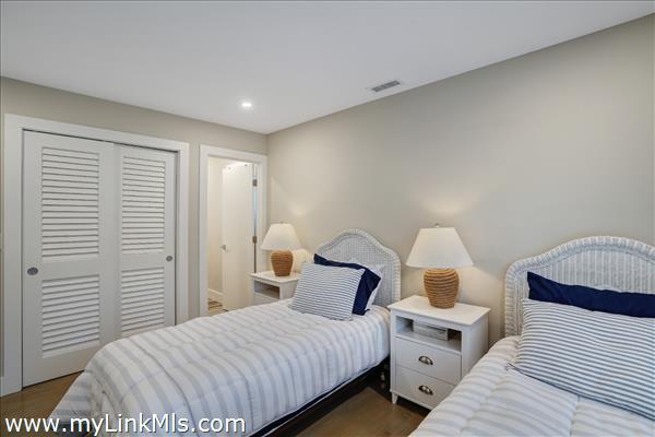 Second floor guest bedroom with en suite bath.
