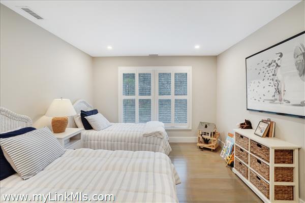 Second floor guest bedroom with en suite bath.