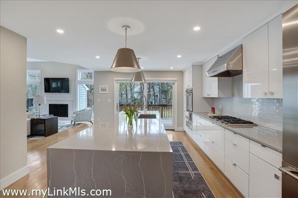 Oversized kitchen island with quartz countertops.