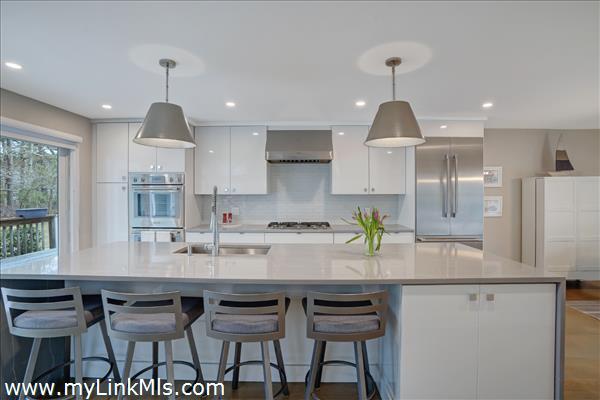 Oversized kitchen island with quartz countertops.