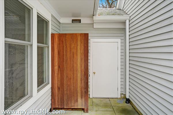 Outdoor shower with mahogany enclosure.