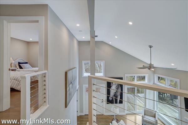 Modern landing overlooking the living room.