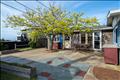 more patio area between the one stall garage & house