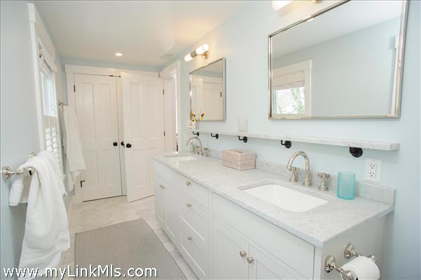 Marble double sinks in primary bathroom