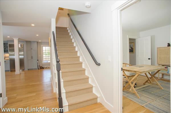 Entry way hall to den, kitchen, second floor