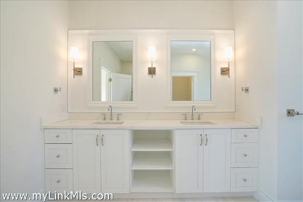 2nd floor primary bathroom with free standing tub, shower stall and private toilet room