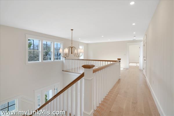 Second floor open hallway off stairway