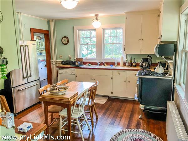 Kitchen with door to butler's pantry at left