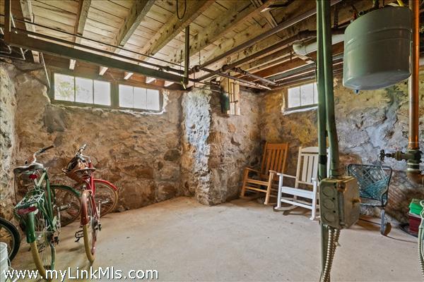 Dry basement with high ceilings and interesting stone foundation