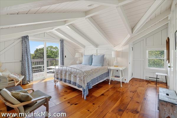 Second floor primary with en suite bath and private deck.