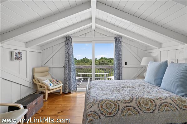 Second floor primary with en suite bath and private deck.