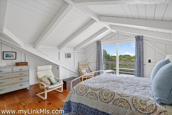 Second floor primary with en suite bath and private deck.