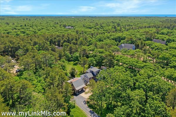 Aerial of Property & Atlantic. Enhanced tree foliage.