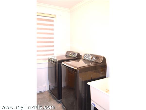 walk in laundry room with sink