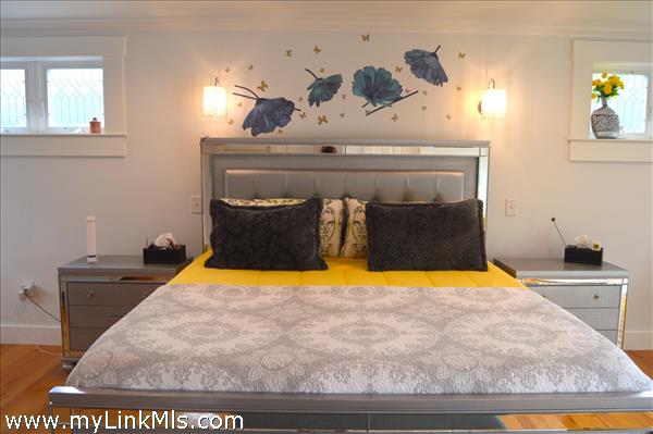 primary bedroom with private bath, balcony and walk-in-closet