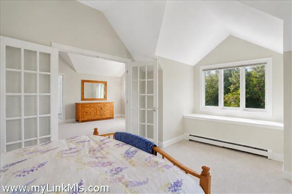 primary en-suite with private lounge area and private exterior deck