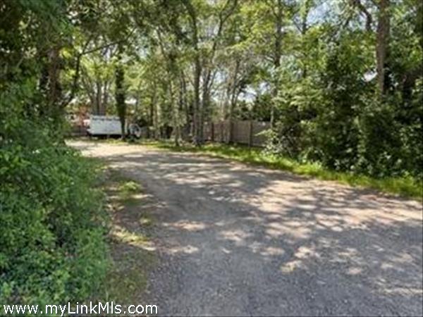 Dirt road next to the vacant commercial land.