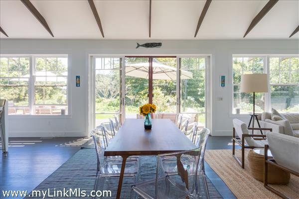 dining facing south overlooking the water and the deck