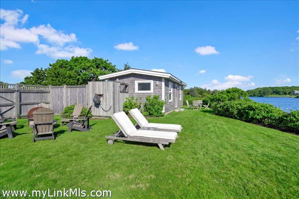 View of backyard and guest cottage