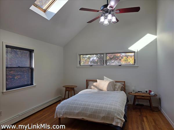 Primary Bedroom with double walk in closet to the right and private bath with Jacuzzi and separate shower and laundry.