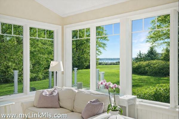 Views from living space out to the Harbor. Photo virtually altered to show seasonality