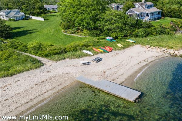 Harborfront lot with private sitting area. Photo virtually altered to show seasonality