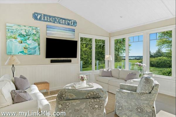 Views from living space out to the Harbor. Photo virtually altered to show seasonality