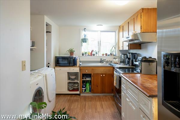 Kitchen with side by side Washer & Dryer