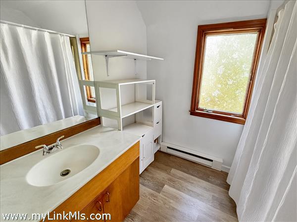 Bath features both a tub and shower