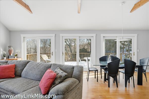 Livingroom and  dining room to extended deck area perfect for entertaining