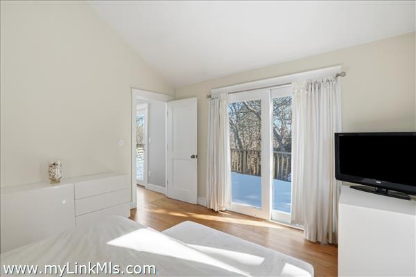 Primary suite to exterior deck.