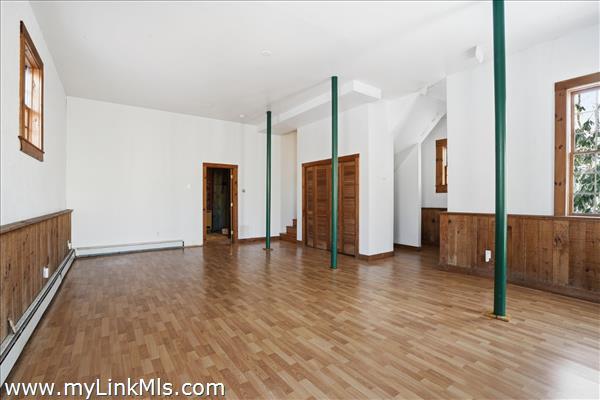 Large basement with eighteen foot ceiling and full bath.