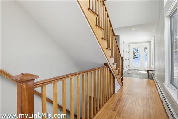 Wood flooring throughout the home with beautiful cherry stairways.