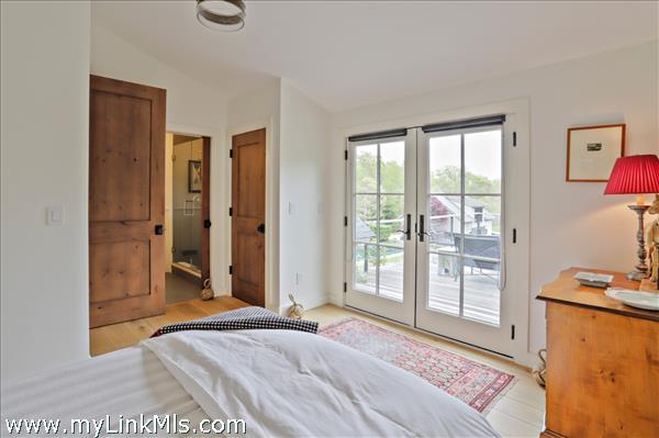 Guest bedroom with ensuite bath and roof deck