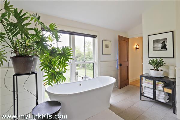 Principal bathroom with freestanding tub.