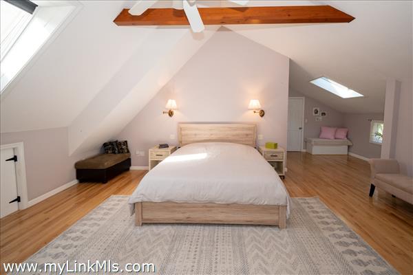 Magnificent master bedroom with vaulted ceilings.