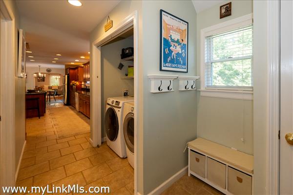 Washer/dryer area adjacent to the kitchen.
