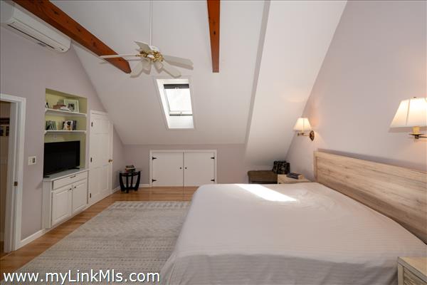 Alternate view of the master bedroom with skylight.