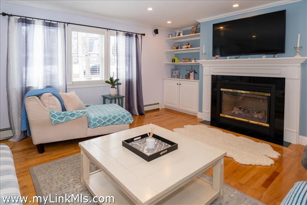 Large living room with fireplace.