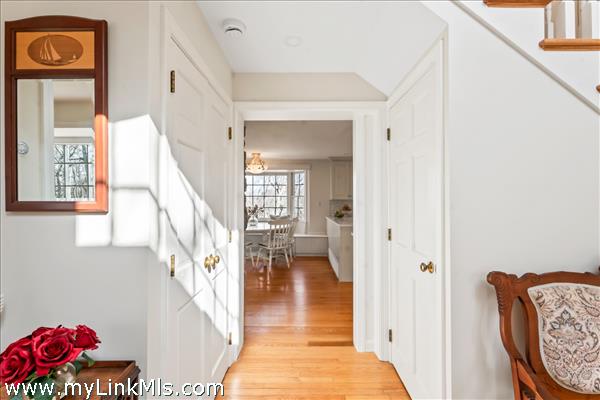 Light filled entry way leads to the kitchen, stairs to the second floor