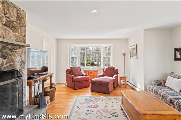 Living Room features oak floors and beautiful bay windows
